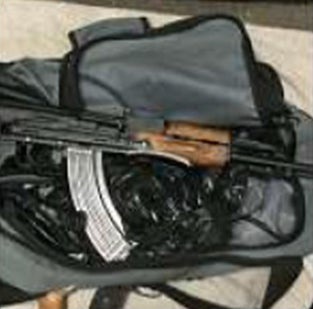 Undated handout photo issued by the Metropolitan Police of a Kalashnikov in a bag (Metropolitan Police)
