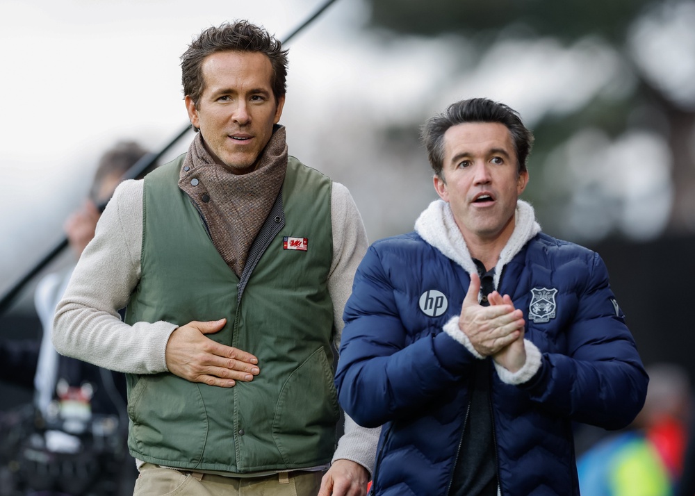 Wrexham co-owners Ryan Reynolds, left, and Rob Mac, right, have been happy to build slowly during the club’s rise, says boss Phil Parkinson (Cody Froggatt/PA) (PA Wire)