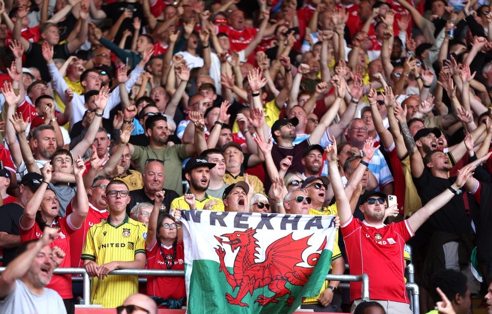 Wrexham fans are hoping to celebrate a fourth consecutive promotion through the Championship play-offs (Steven Paston/PA) (PA Archive)