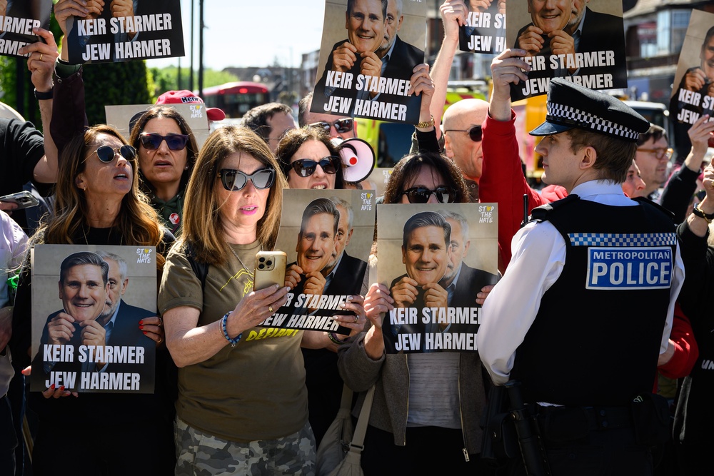 The prime minister was heckled as he arrived at a Jewish community ambulance centre in Golders Green on Thursday (Getty)