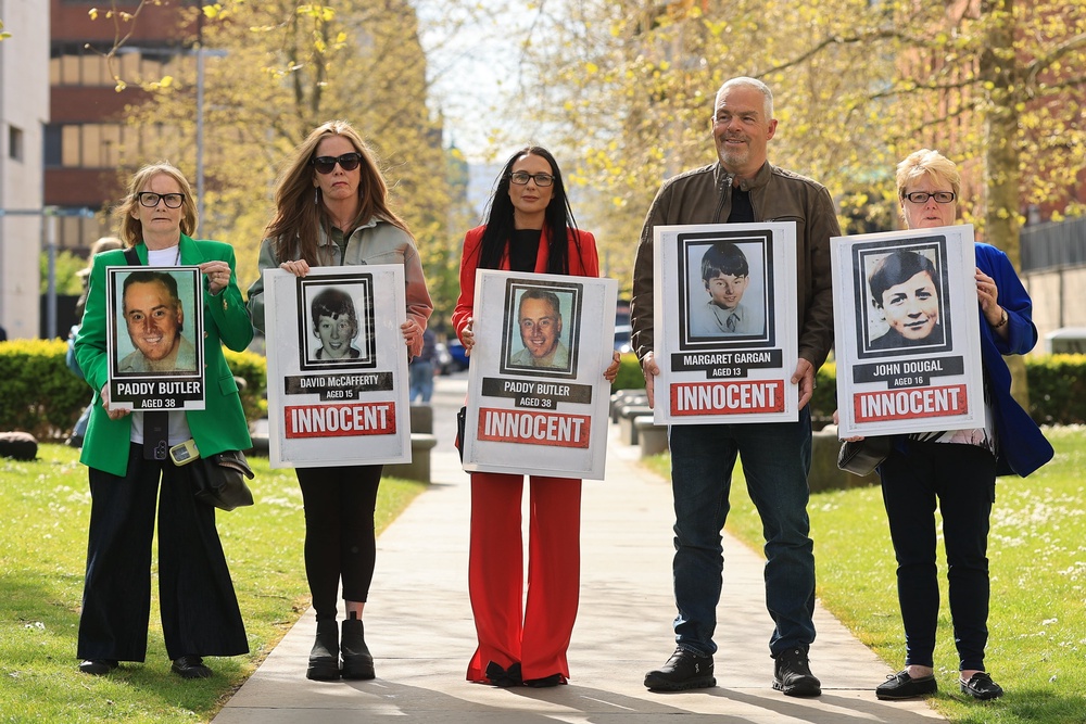 Natasha Butler (centre) with relatives of those killed during the Springhill Westrock killings outside Belfast Coroner’s Court (Liam McBurney/PA) (PA Wire)