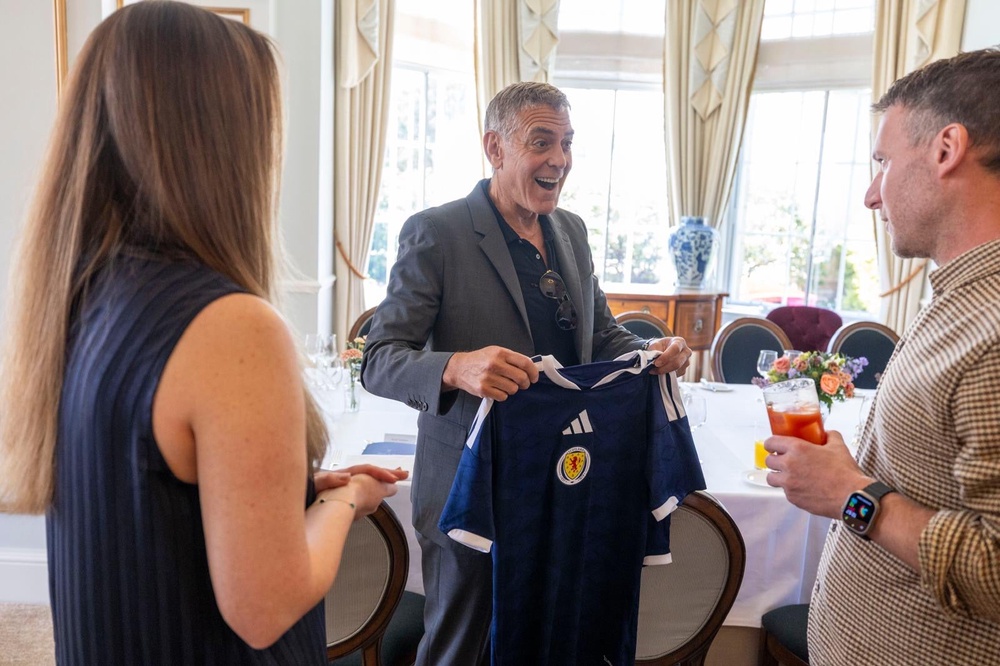 George Clooney receives a Scotland strip (Social Bite/PA) (Social Bite)
