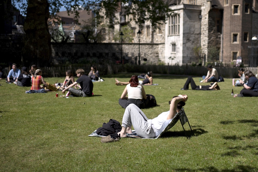 People enjoy the sun in Charterhouse Square, London (Jordan Pettitt/PA) (PA Wire)