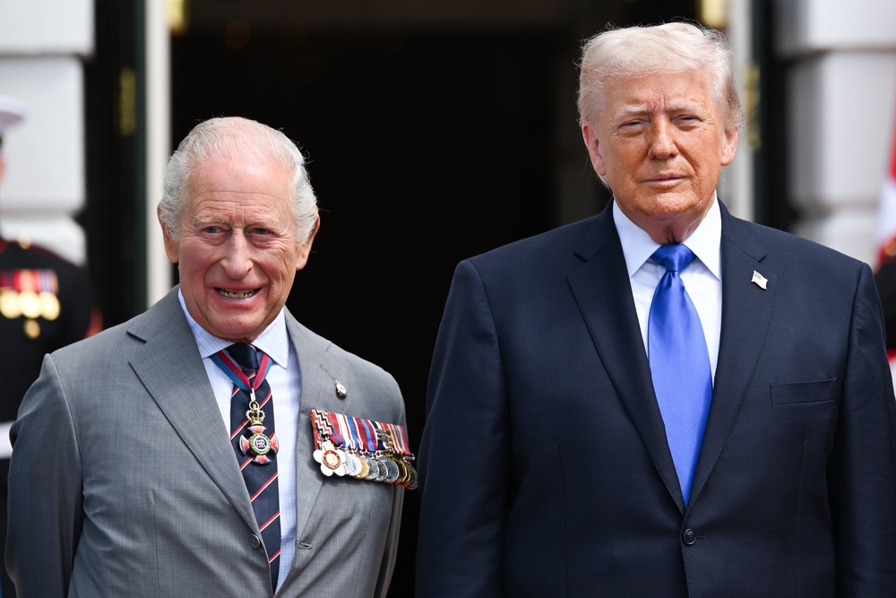 US President Donald Trump bids farewell to Charles outside the White House (PA)