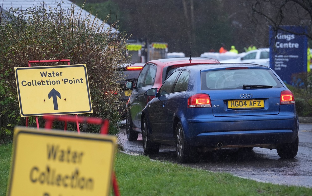 South East Water customers collect bottled water (Gareth Fuller/PA)