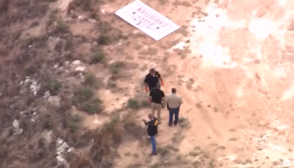 Investigators at the scene in Oklahoma where Christian was found dead inside his truck, with a campaign sign visible nearby (KOCO 5 News)