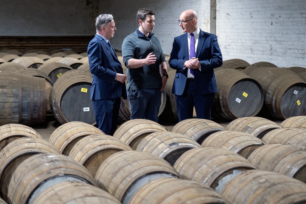 First Minister John Swinney, right, and Stirling SNP candidate Alyn Smith, left, with distillery manager Murray Kerr at the Deanston Distillery (Jane Barlow/PA) (PA Wire)