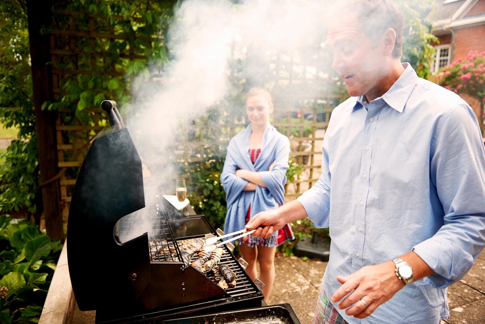 Smoke from a barbecue is a common trigger (Alamy/PA)