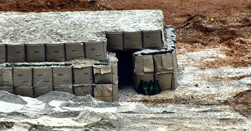 Sand bags covering the unexploded Second World War bomb in Plymouth (PA)