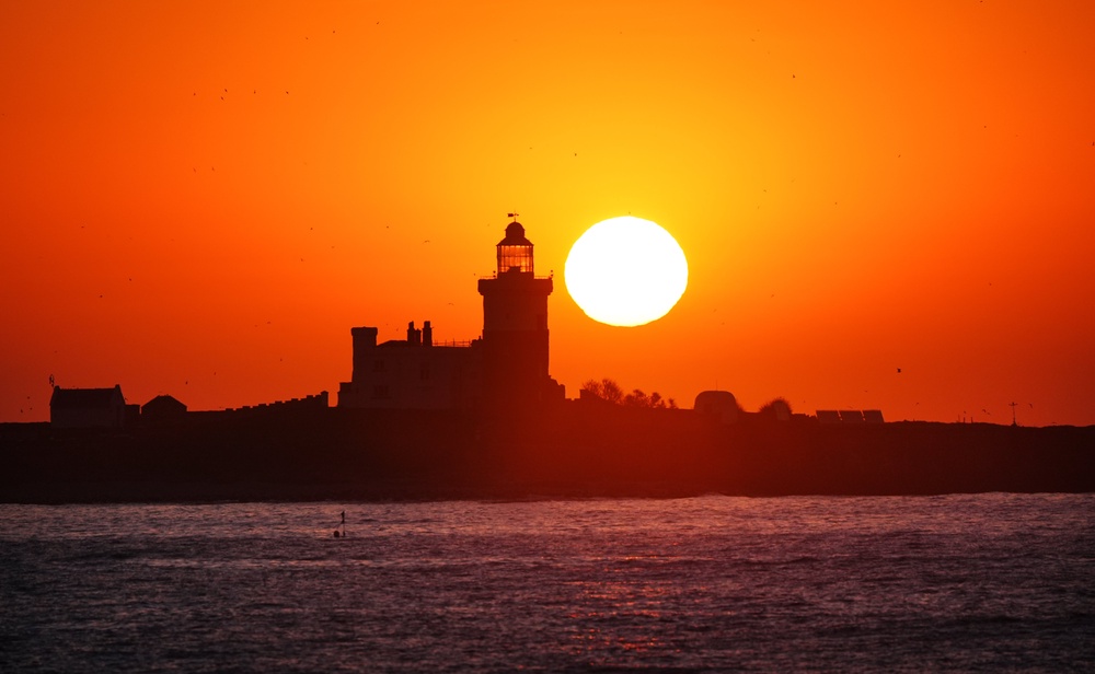 The May Day sun rises over Coquet Island (Owen Humphreys/PA) (PA Wire)