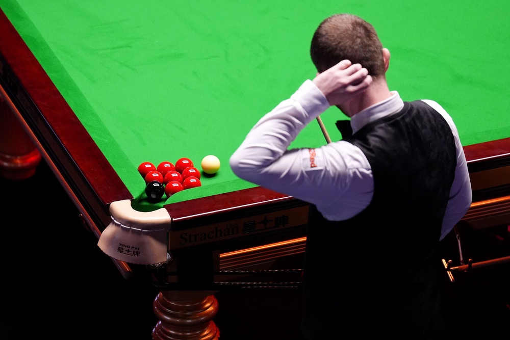 The black and eight remaining reds clustered around the corner pocket to the bemusement of both Allen and opponent Wu Yize (PA Wire)