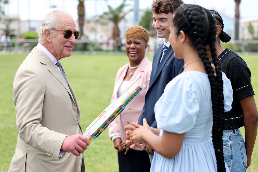The King speaks to the winner of the Commonwealth Baton Relay design competition (Chris Jackson/PA) (PA Wire)