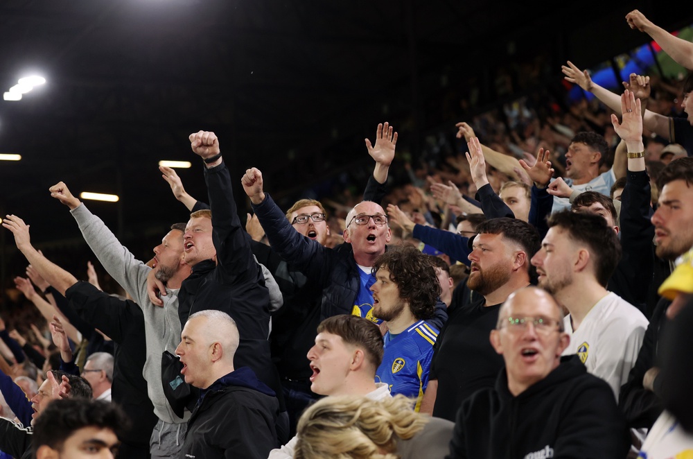 Leeds fans celebrate their third goal of the game (Getty)