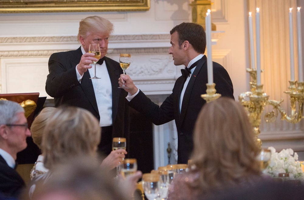 When French President Emmanuel Macron and Ukrainian President Volodymyr Zelenskyy visited last summer, Trump showed them a merchandise room off the Oval Office stocked with goods for sale on his website (Getty)