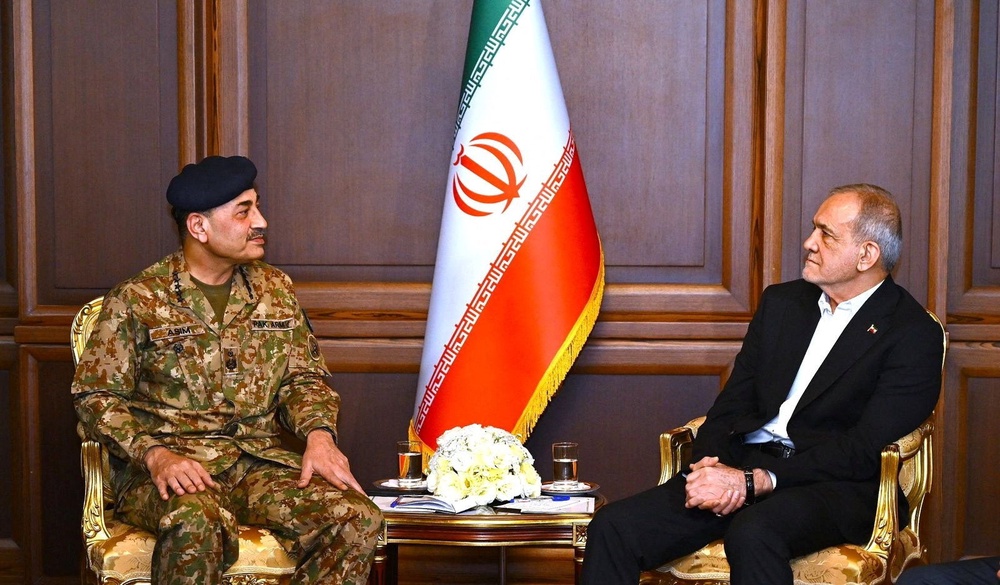 Iranian president Masoud Pezeshkian meets with Pakistan army chief Field Marshal Asim Munir in Tehran (Reuters)