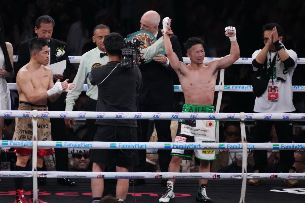 Takuma Inoue sees his hand raised (AP)