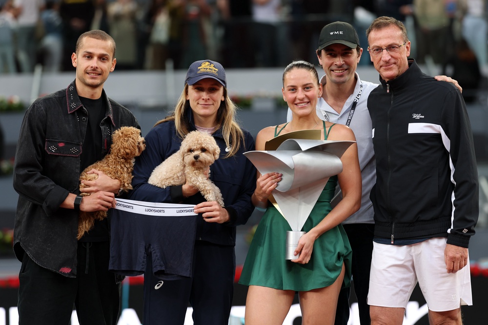 Kostyuk with her team, two dogs and ‘lucky’ underwear (Getty)