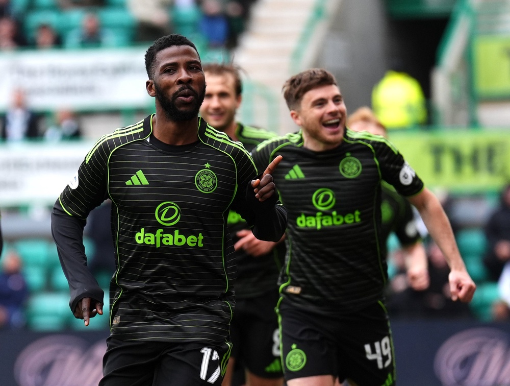 Celtic defeated Hibs last weekend to remain three points behind leaders Hearts with three games to play (PA)