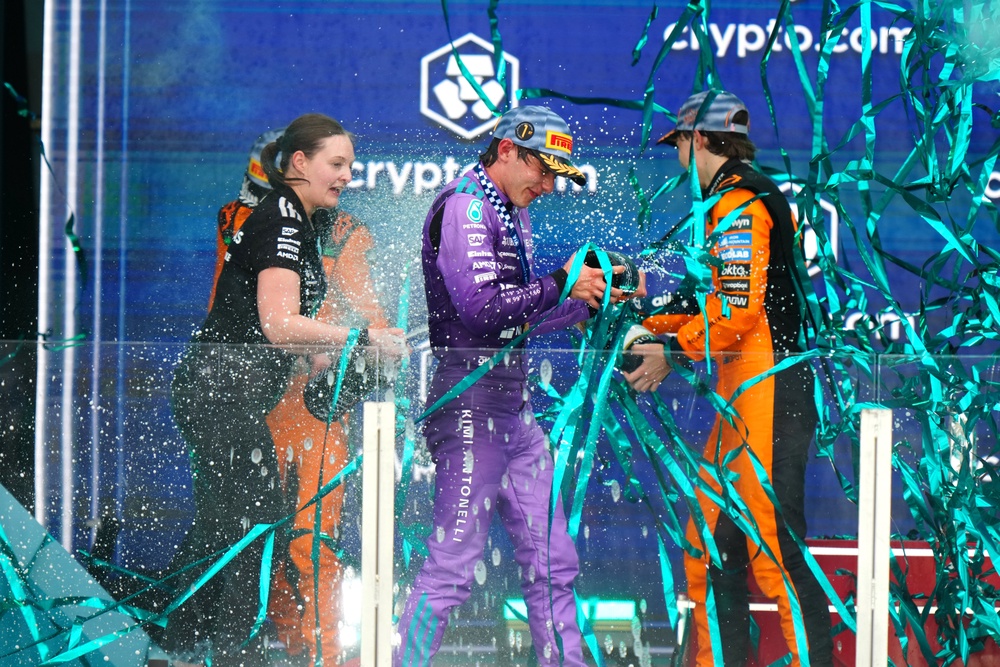Antonelli (centre) celebrates on the podium (Bradley Collyer/PA) (PA Wire)