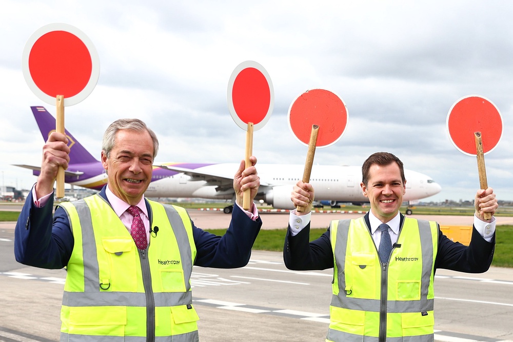 Party leader Nigel Farage with defector Robert Jenrick at Heathrow airport in March (Getty)