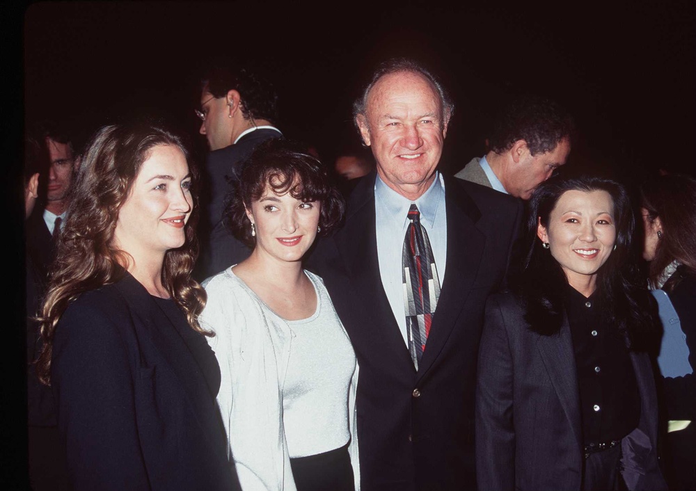 Actor Gene Hackman, center right, and his wife Betsy Arakawa, far right, pose with daughters Leslie, center left, and Elizabeth at the premiere of his movie “The Chamber” in October 1996 in Beverly Hills, California. Both Arakawa died after suffering a hantavirus infection in February 2025 (Getty Images)
