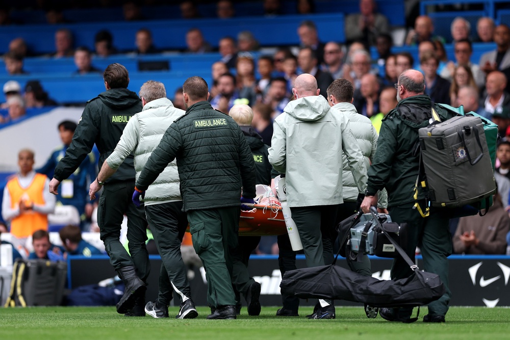 The 18-year-old was attended to by medical staff and taken off on a stretcher (Getty)