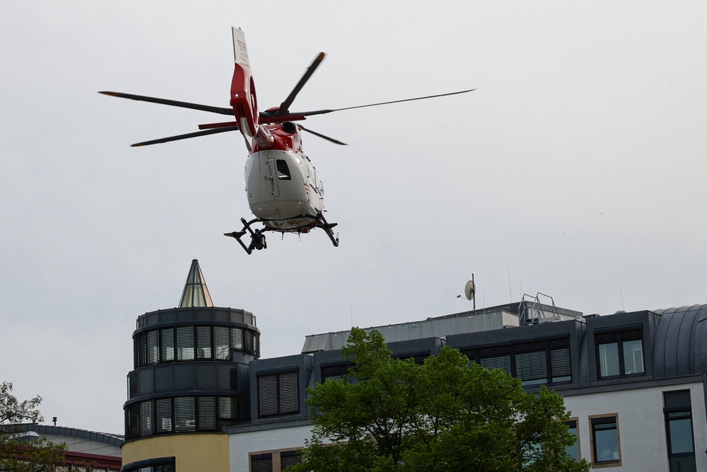 An emergency services helicopter pictured near the scene (AFP/Getty)