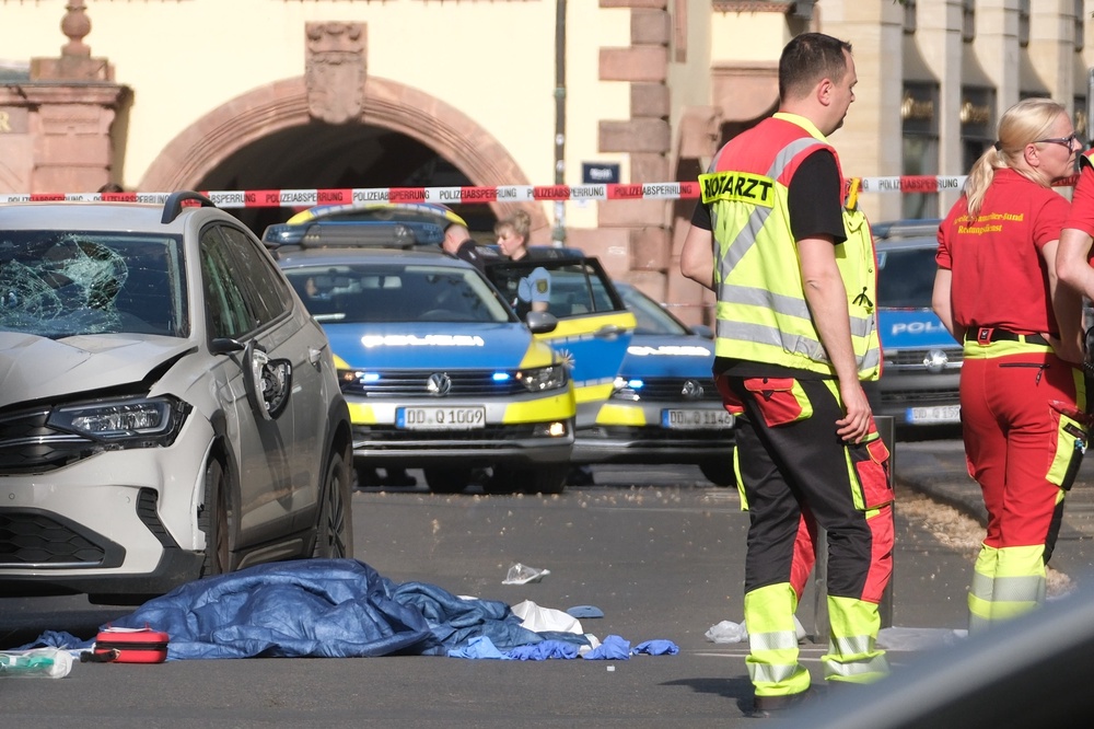 Emergency services at the scene in Grimmaische Strasse, one of Leipzig’s main shopping streets (DPA)