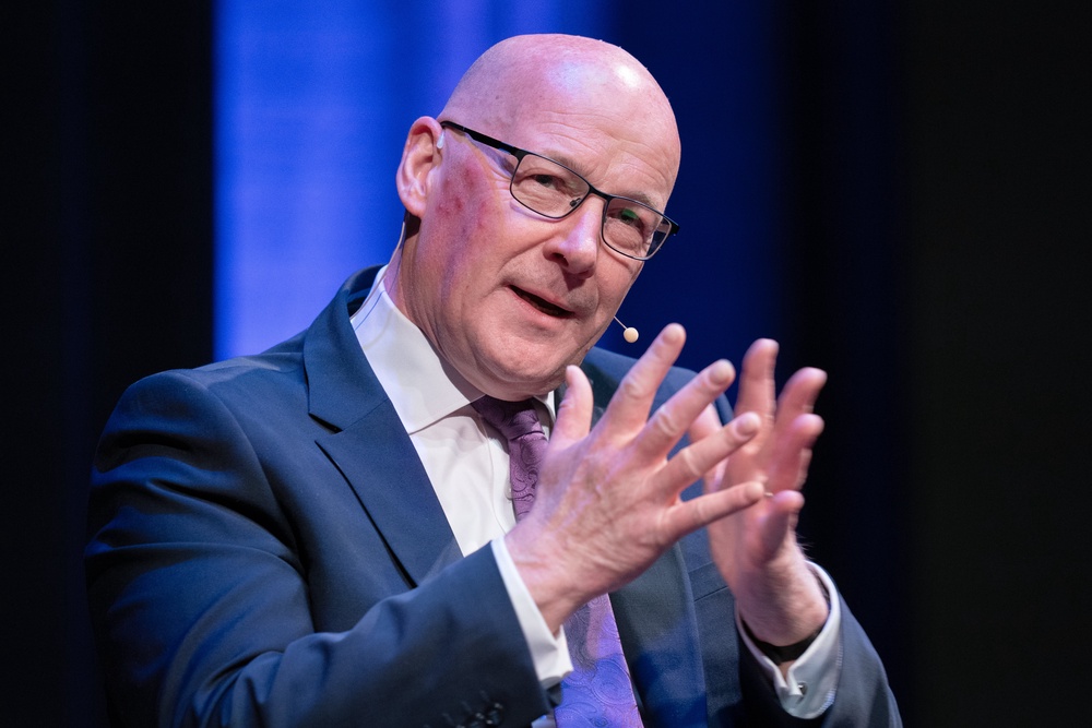 John Swinney gestures while on stage (Jane Barlow/PA) (PA Wire)