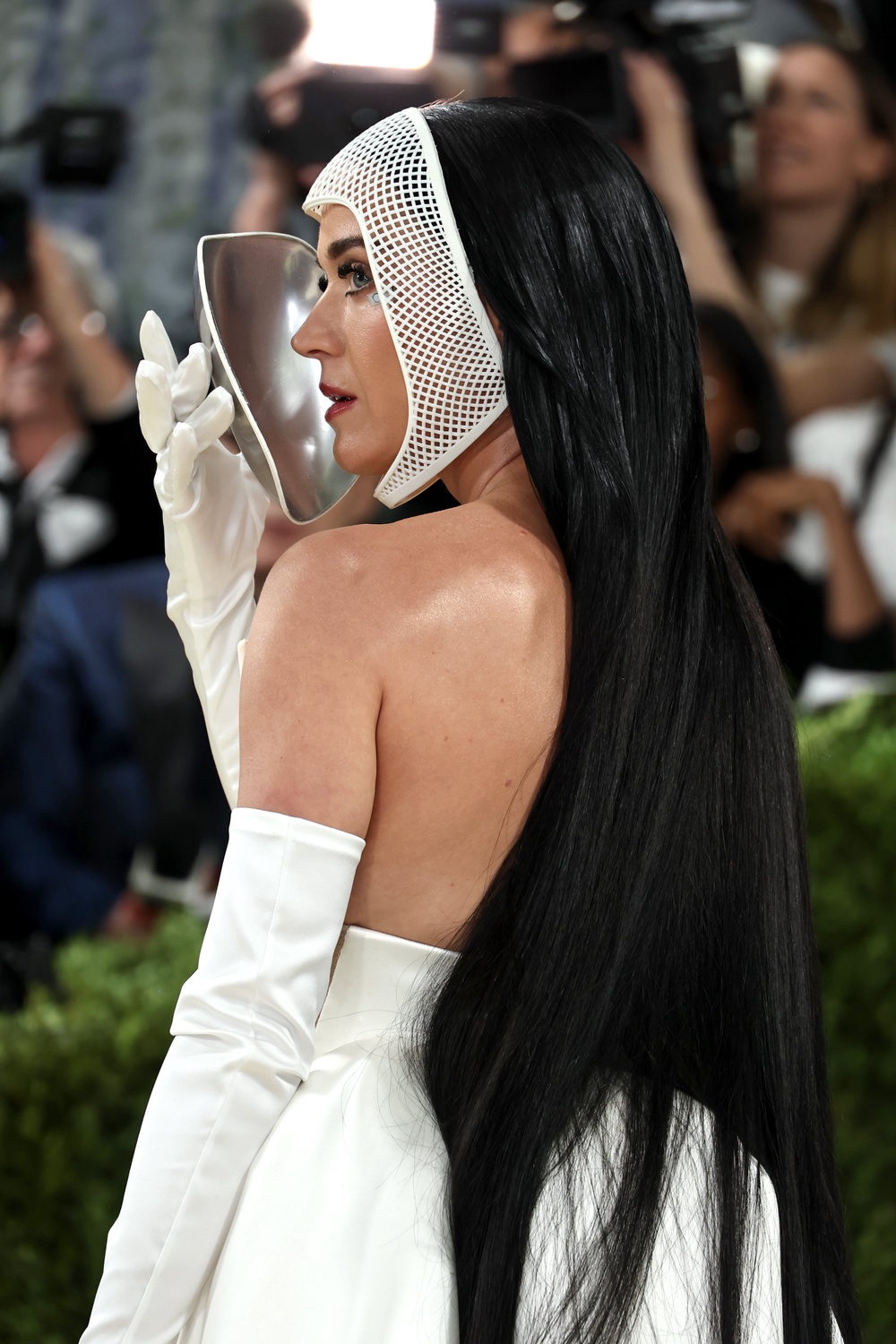 Get ready to joust... Katy Perry in a white gown with a headpiece that covered her entire face, by Stella McCartney (Getty)