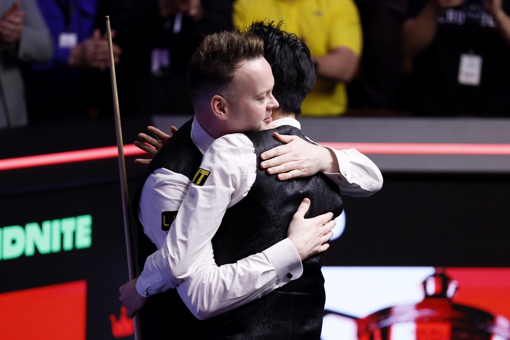 Wu (right) and Shaun Murphy embrace after the Chinese star’s victory (Richard Sellers/PA) (PA Wire)