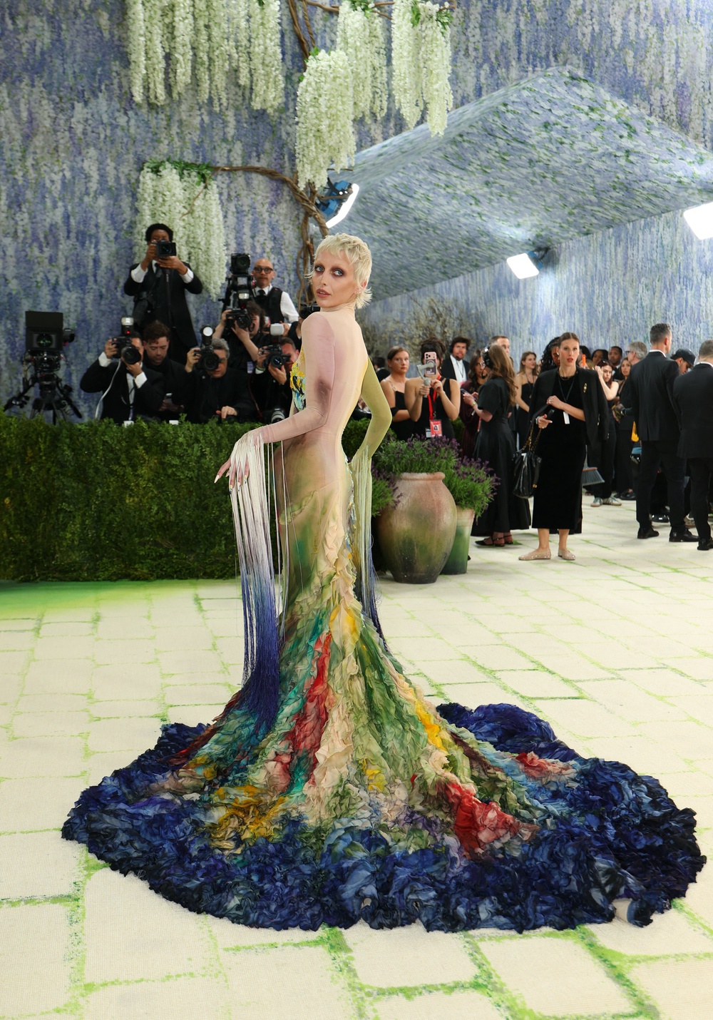 The gown features a mesh turtle neck and cascading fabric with a multi-toned watercolor design (AFP/Getty)