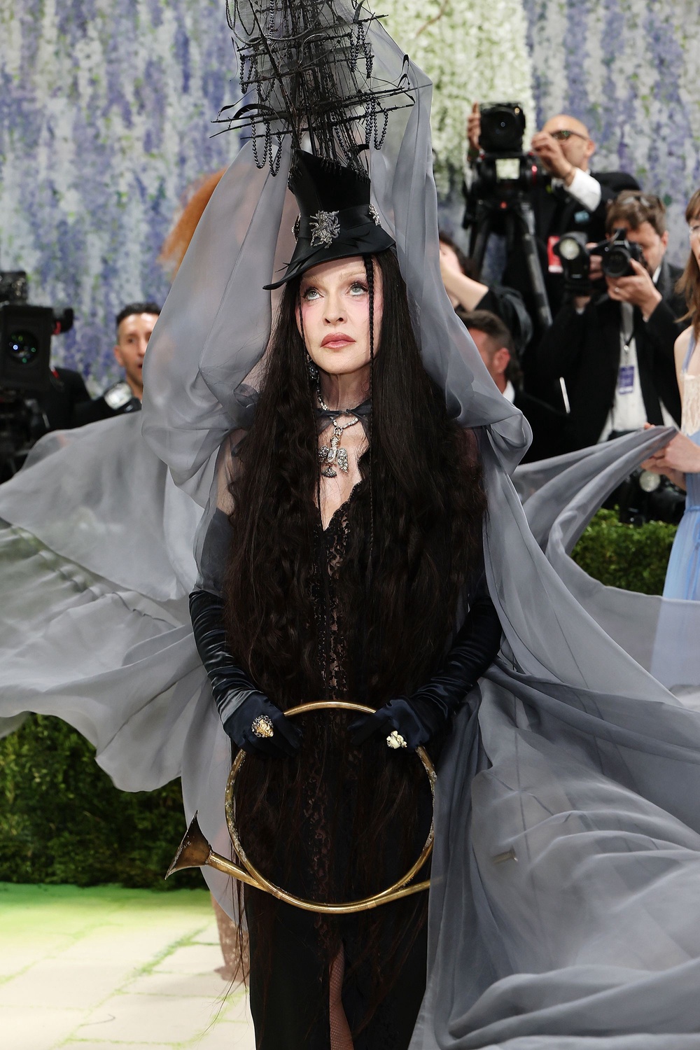 Madonna channelled a spooky vibe, wearing an Anthony Vaccarello Saint Laurent design, accessorized with a pirate-ship hat and a brass circular trumpet (Getty)