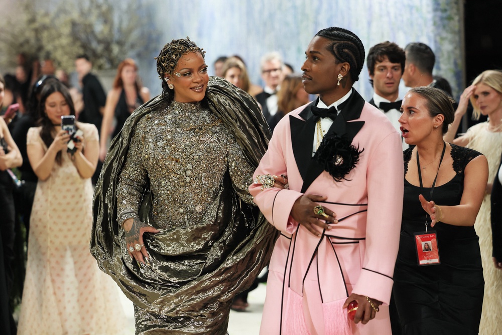 Rihanna was joined by her husband A$AP Rocky, who wore a custom Chanel  pink robe with black satin lapels and black piping details, embellished with a black silk (Reuters)