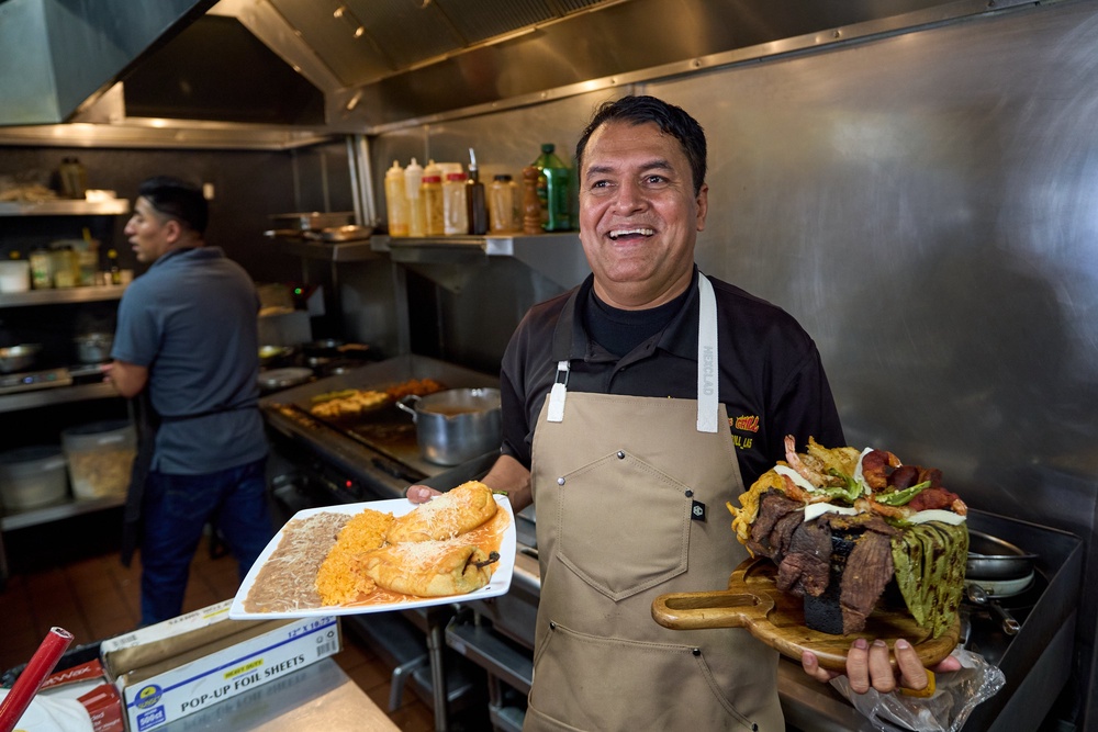 Mexican restaurant owner-chef Marco Mendoza prepares a hot molcajete (Copyright 2026 The Associated Press. All rights reserved.)