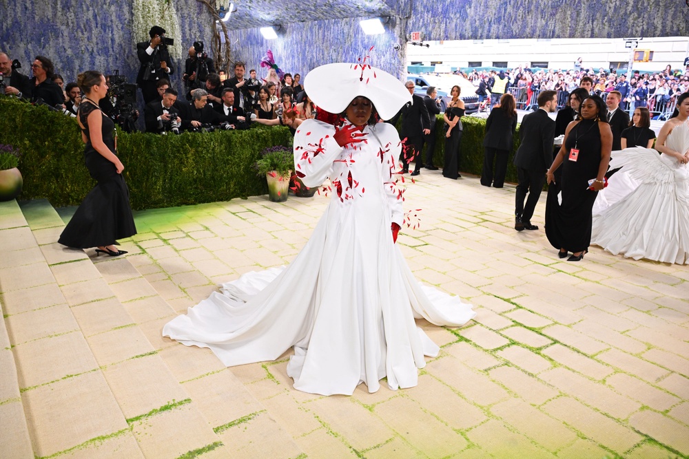 Naomi Osaka revealed a red bodysuit underneath her white coat (Matt Crossick/PA) (PA Wire)