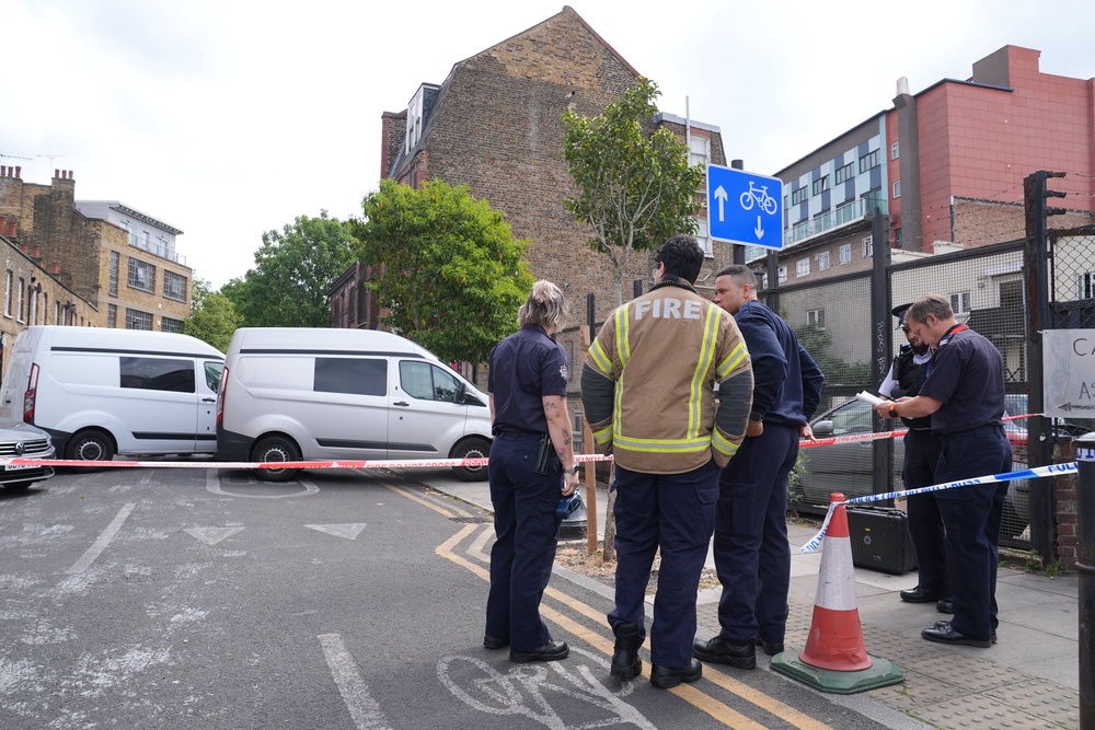 Police and fire officers outside the former East London Central Synagogue on Nelson Street in Whitechapel (Lucy North/PA) (PA Wire)