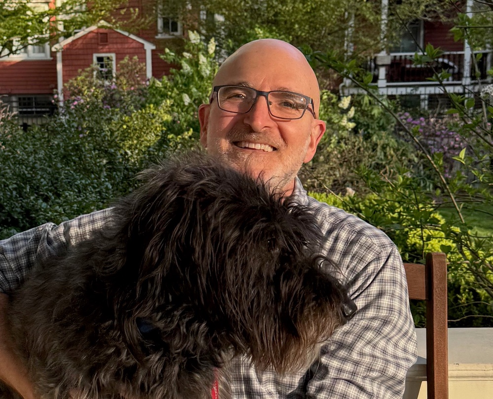 Daniel Promislow with Pete, a half Curly-coated retriever and half Beagle (Daniel Promislow)