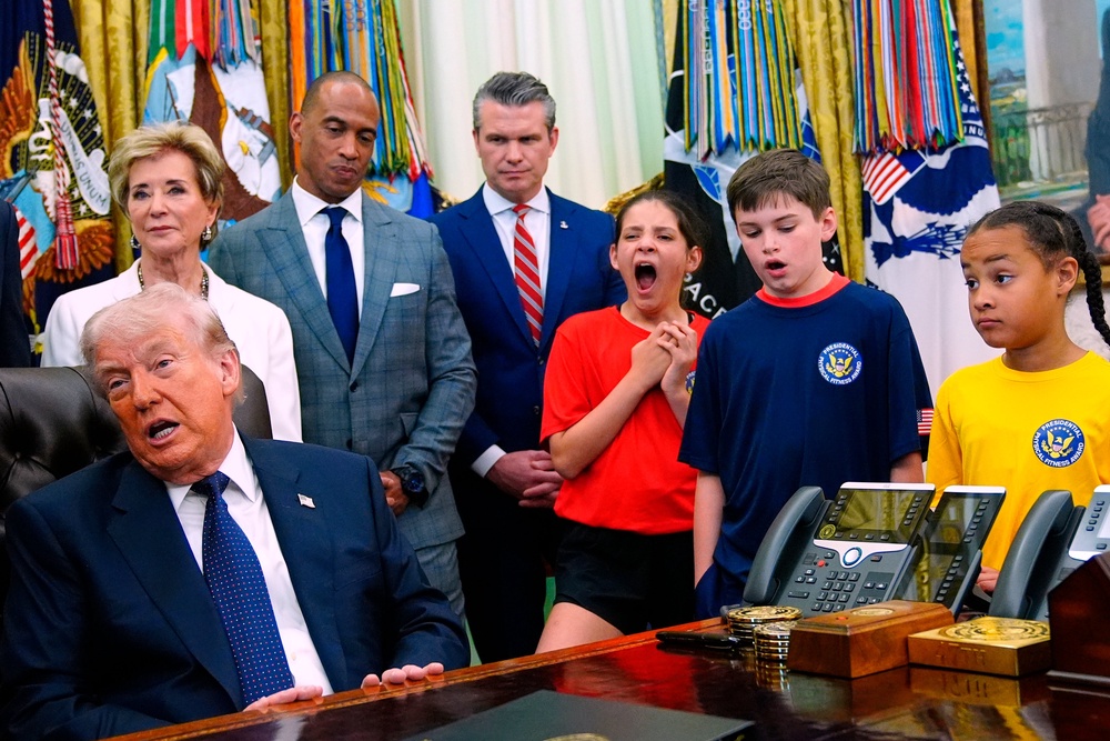 Visibly bored, a group of children listened to Trump talk about protesters being murdered in Iran and a blockade of the Strait of Hormuz at a White House event on Tuesday (AP)