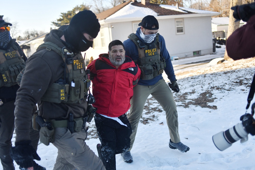 Most Americans think ICE’s actions have gone too far, according to a February poll. Pictured here, federal immigration agents detain a man in St. Paul, Minnesota, on January 27, 2026. (AFP via Getty Images)