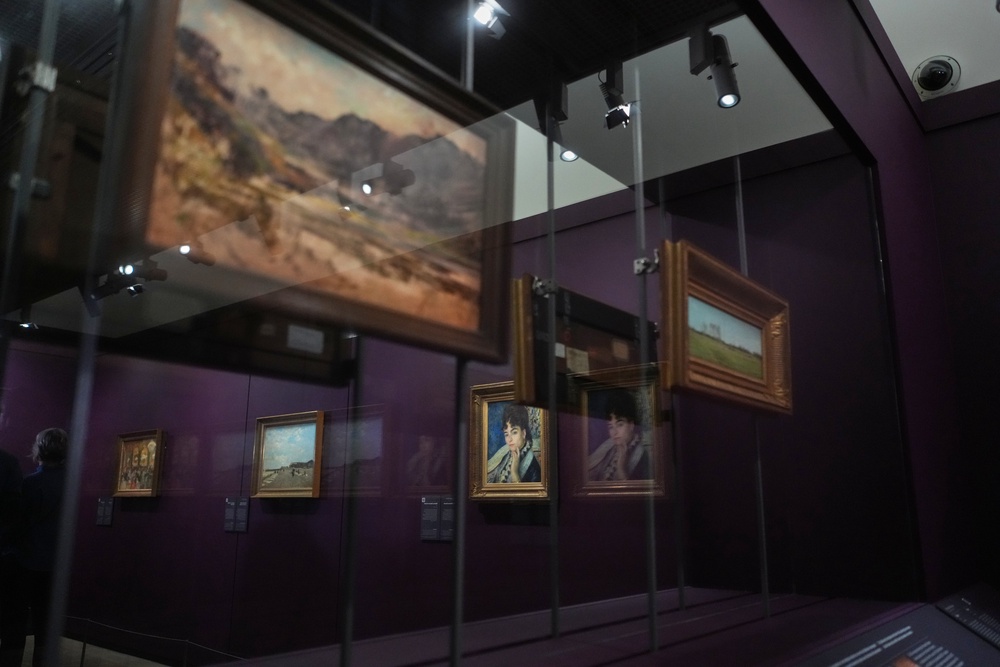 French painter Pierre-Auguste Renoir's painting titled ‘Madame Alphonse Daudet’, center, is on exhibit in the Musée d'Orsay museum's new permanent gallery dedicated to so-called MNR artworks, ((AP Photo/Thibault Camus))