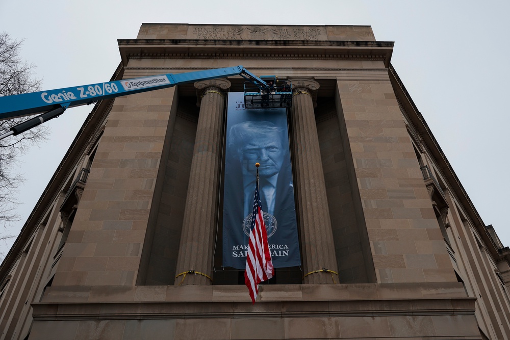 Another banner with Trump’s face that read, 'Make America Safe Again,' was hung on the facade of the Department of Justice building in Washington this past February (Getty Images)