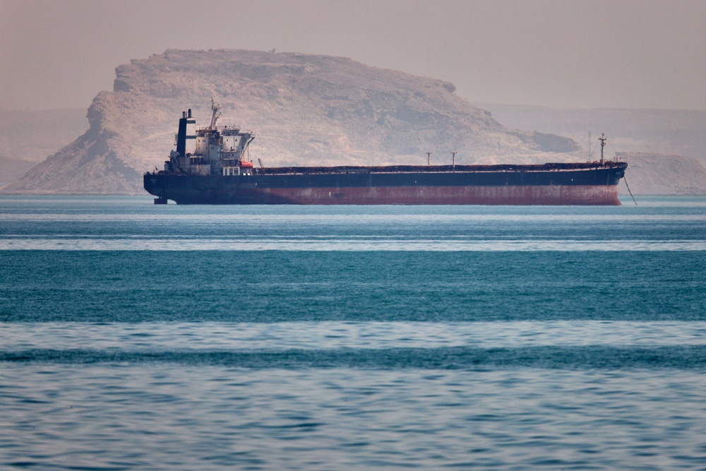 A bulk cargo ship sits at anchor in the Strait of Hormuz (Amirhosein Khorgooi/ISNA via AP) (AP)