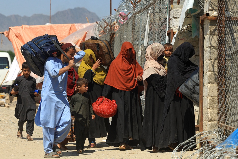 Afghan women walk on the outskirts of Kabul (Reuters)