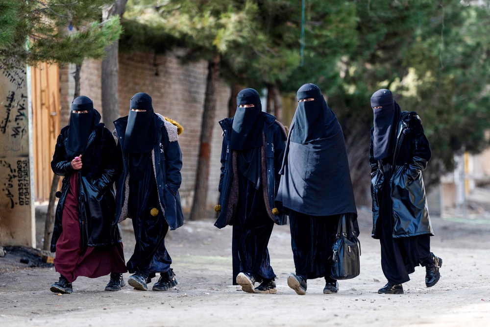 Afghan women walk on the outskirts of Kabul (AFP via Getty)