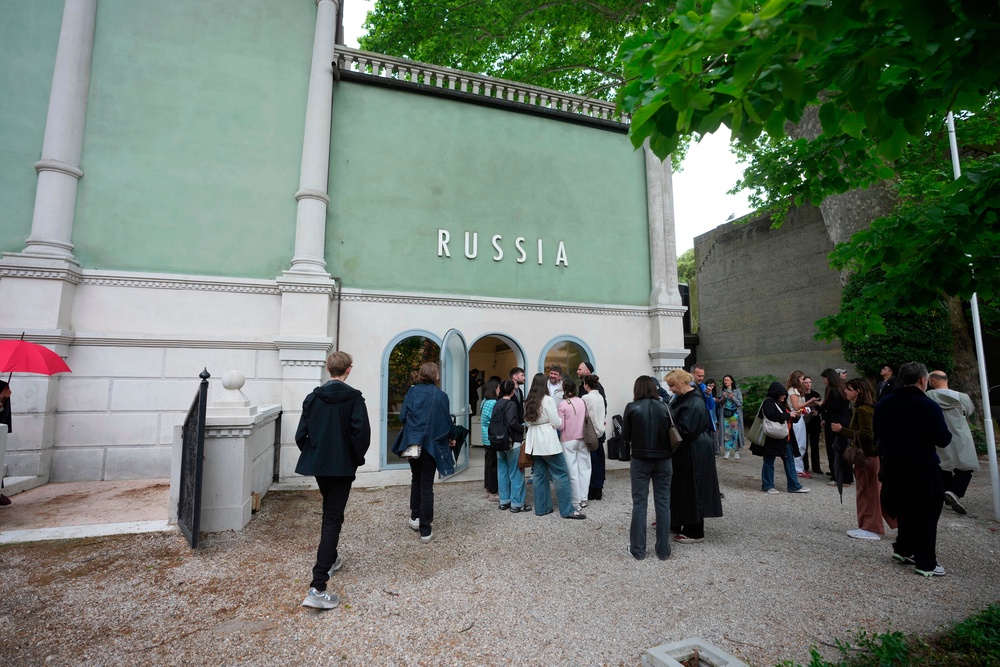 Visitors stand outside the Russia pavilion. (AP)