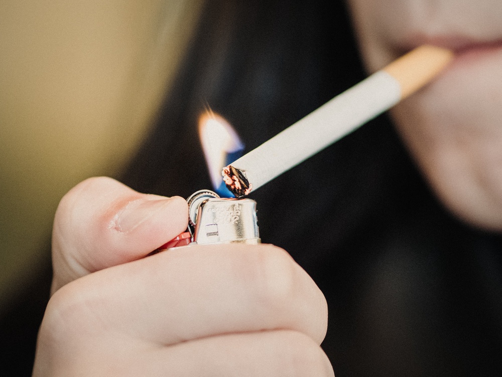 Some told the survey they had bought cigarettes from people selling them in pubs or from people selling them cheaply on the street (AFP/Getty)