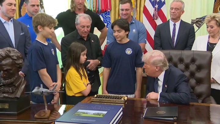 Trump invited athletes and young students to the Oval Office for the announcement (Reuters)