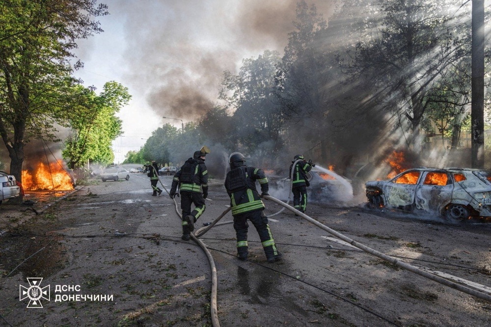 Firefighters work next to burning vehicles at a site of a Russian airstrike, amid Russia's attack on Ukraine, in the frontline city of Kramatorsk in the Donetsk region, Ukraine, May 5 (Emergency Service of Ukraine)