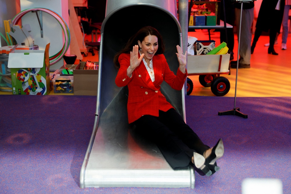 Kate coming down a slide during a visit to the Lego Foundation PlayLab in Copenhagen (PA) (PA Archive)